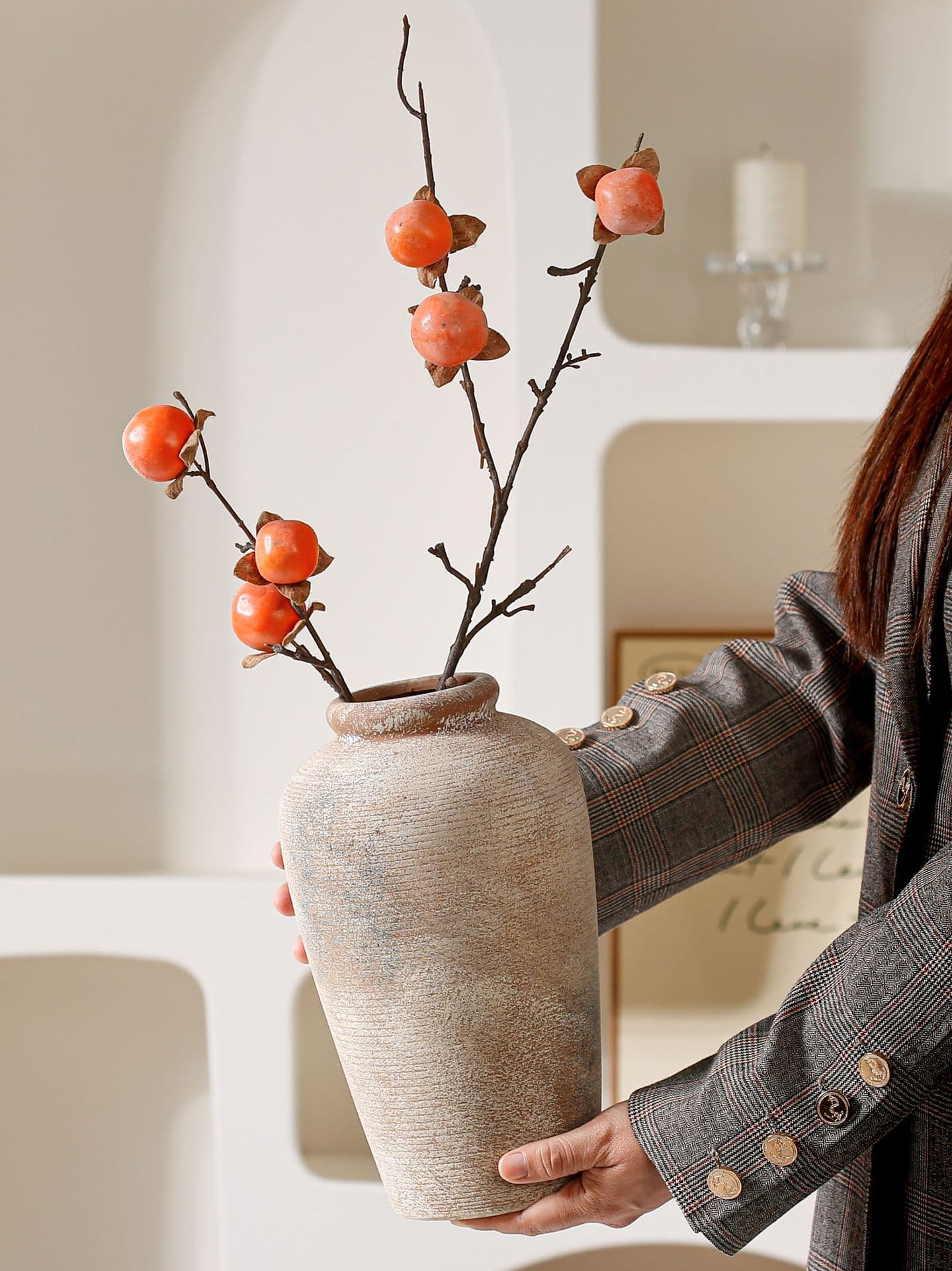 Silent antique ceramic vase held with autumn stems