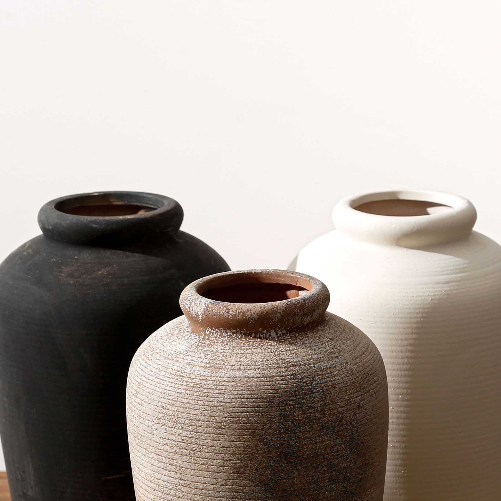 Silent antique ceramic vase trio in matte stone glazes
