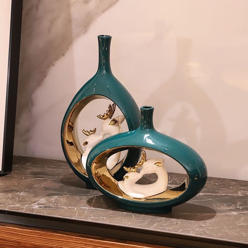 Teal swan ceramic vase set displayed as a pair