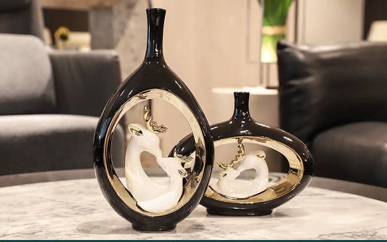 Black swan ceramic vase set on a living room console