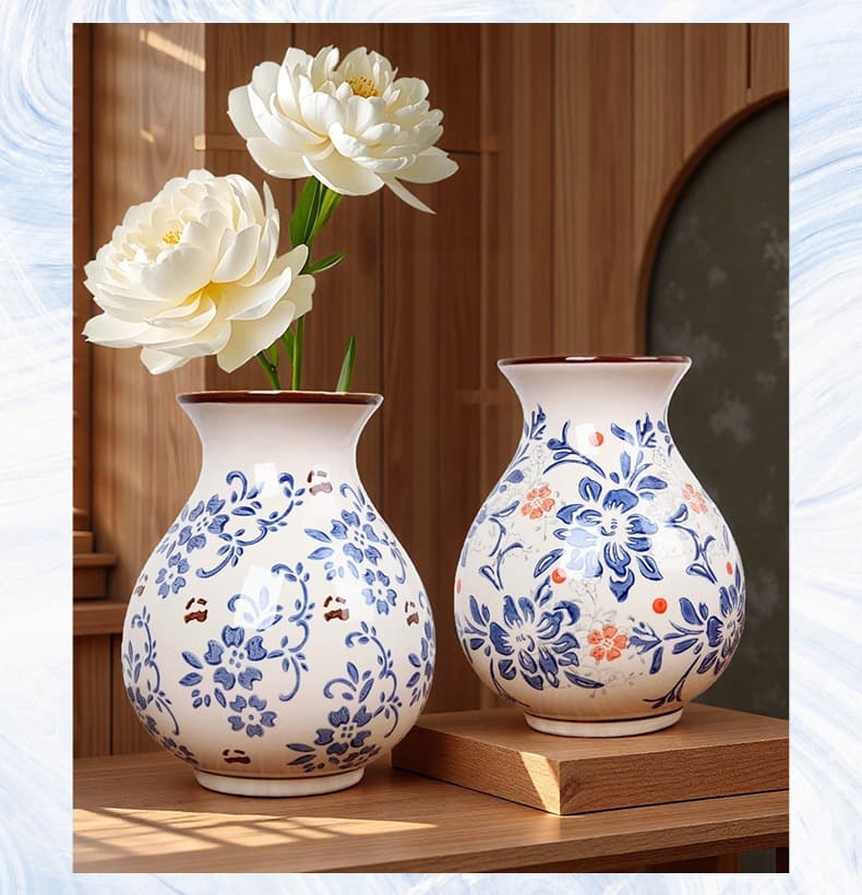 Pair of hand-painted blue porcelain vases on a wooden stand