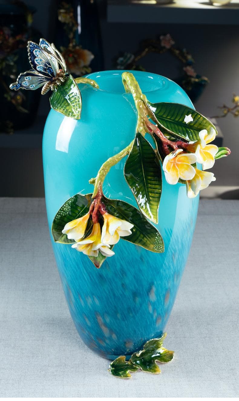 Tall turquoise enamel glass vase with sculptural floral detail